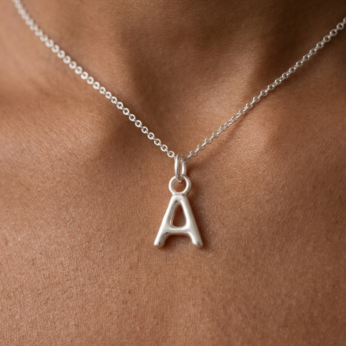 Kat Cadegan 'A' initial pendant in sterling silver on silver chain.