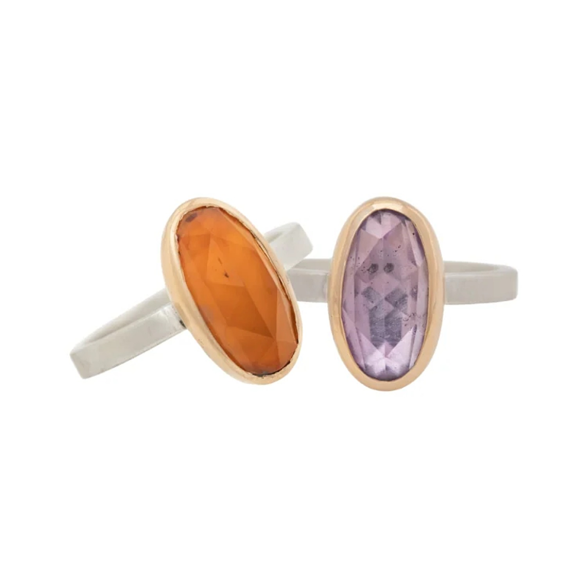 Two Ave rings with orange and purple oval rose cut gemstones in 14k gold bezels on silver bands
