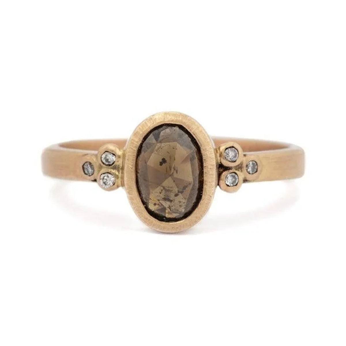 Conie custom ring with an oval cognac diamond and six small diamonds in 14k gold