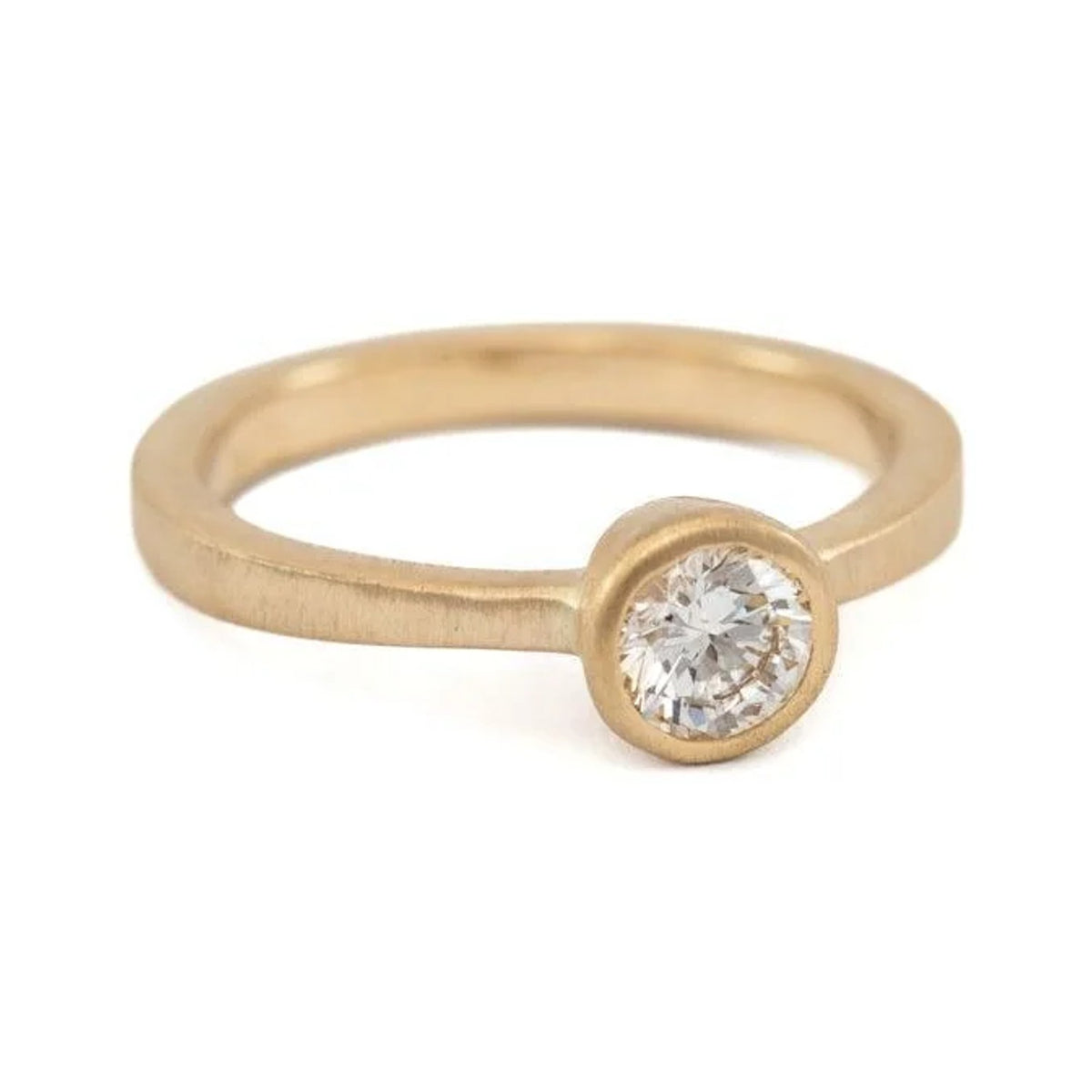 Emma round diamond solitaire ring in matte 14k gold with a bezel setting, front view