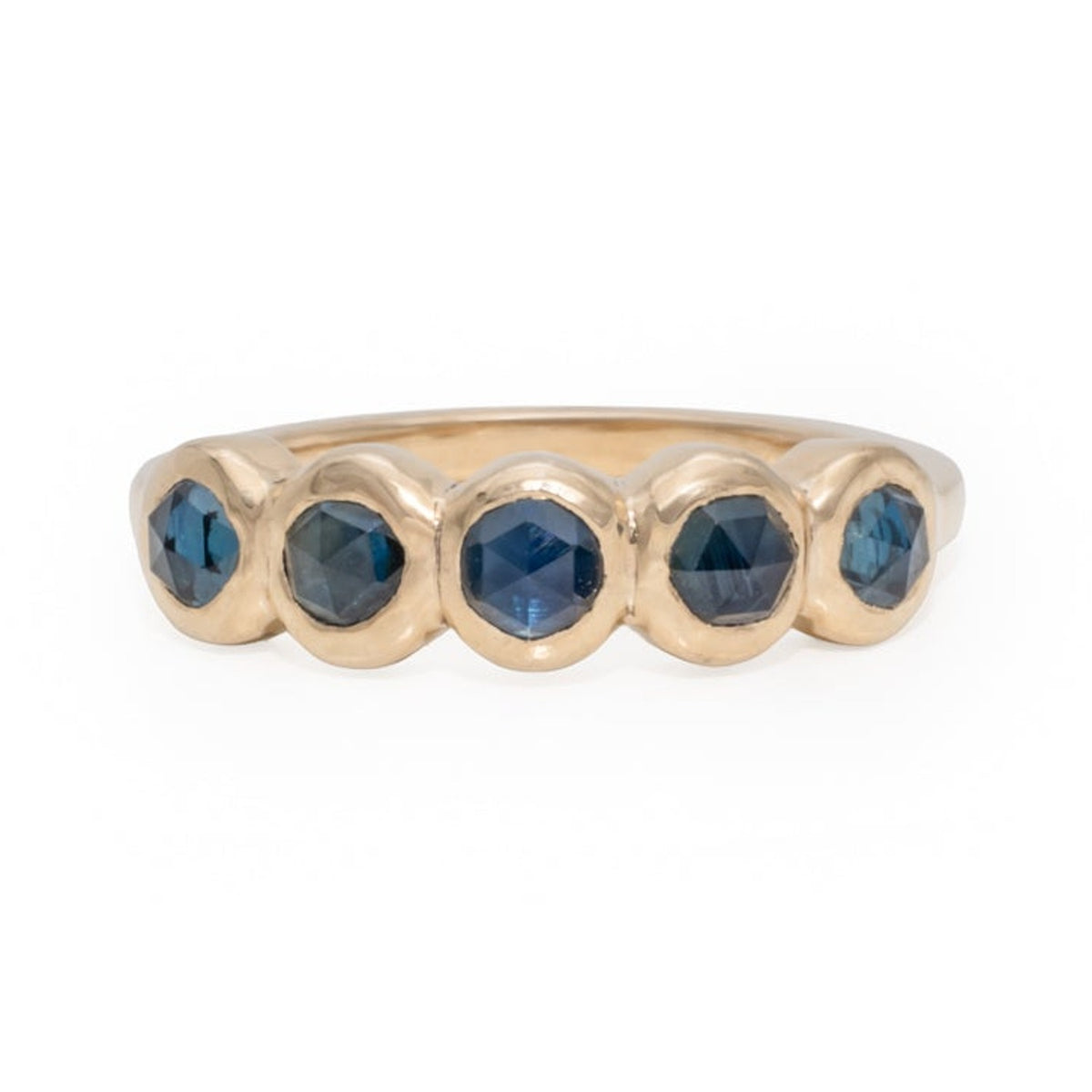 Frida ring with five round blue sapphires in 14k gold bezels, front view