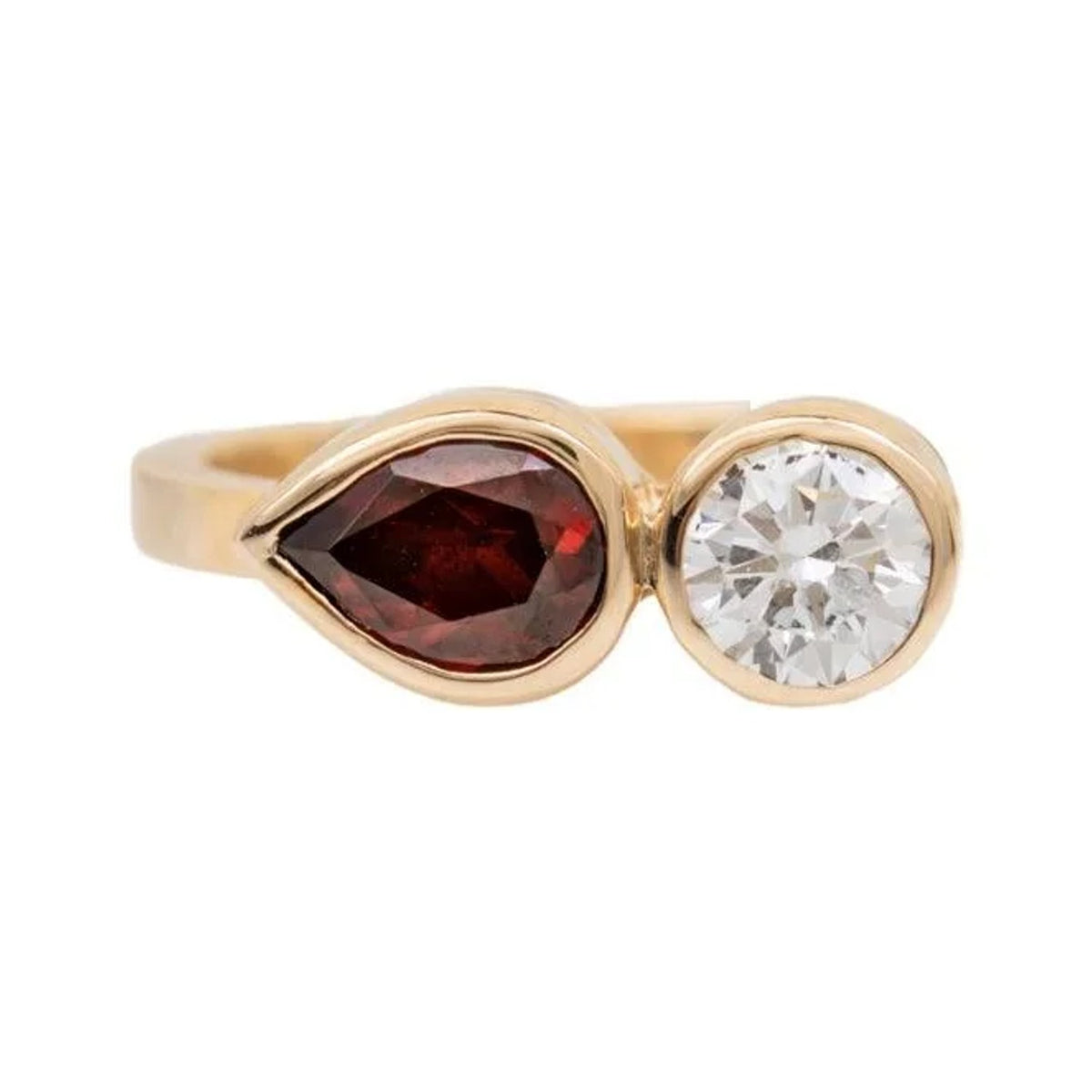Maggie custom ring with a bezel-set pear garnet and round diamond in gold, front view