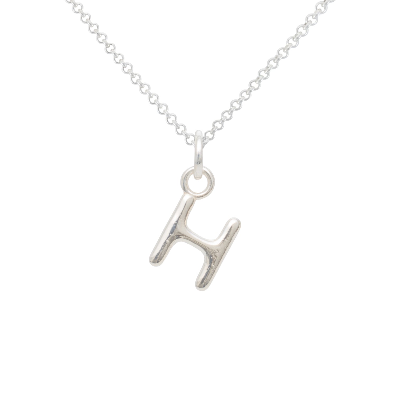 Silver necklace with a letter 'H' pendant on a white background