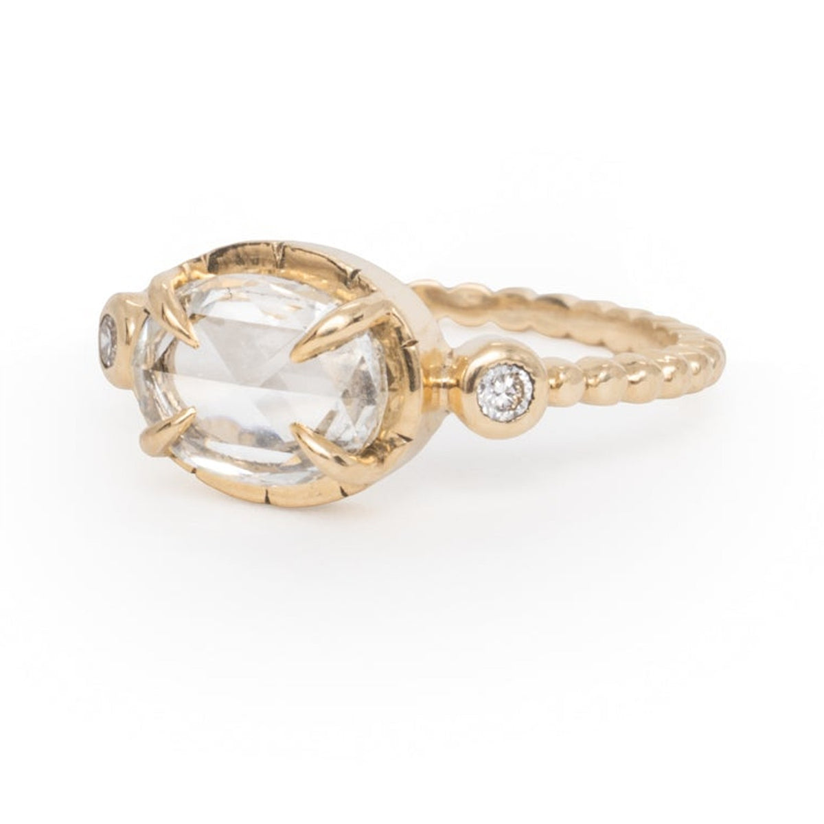 Jane engagement ring with a 1.57 ct lab-grown diamond on a beaded yellow gold band, on a white background
