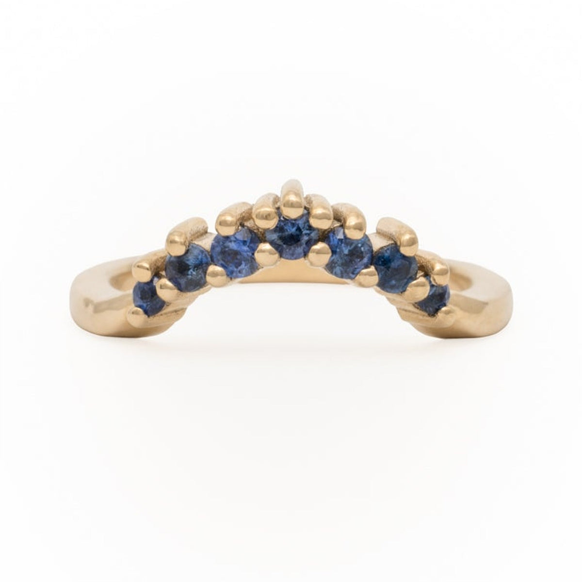 Jessica custom curved band with a row of blue stones and beaded details, front view