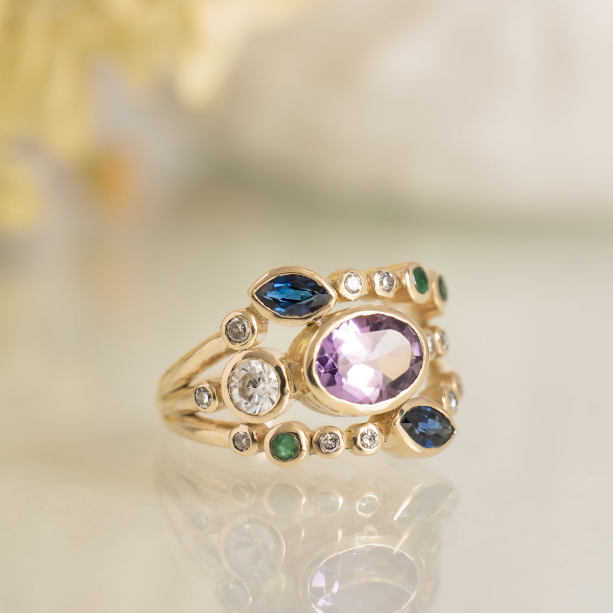 Leah multi-gemstone gold ring with sapphires and pink centre stone, styled - Kat Cadegan