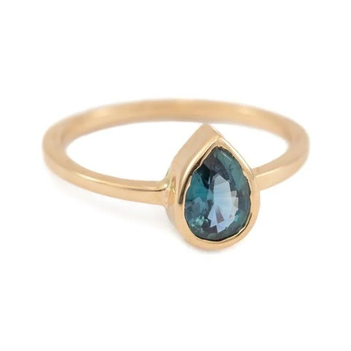 Leah custom ring with a pear teal sapphire in a gold bezel