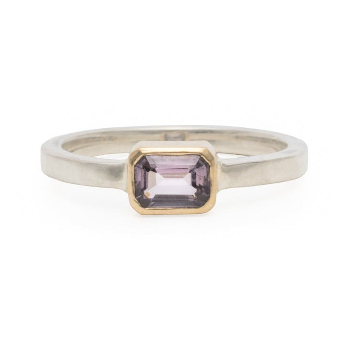 Lavender spinel ring with a 0.51ct emerald cut stone in a 14k gold bezel on a sterling silver band, front view