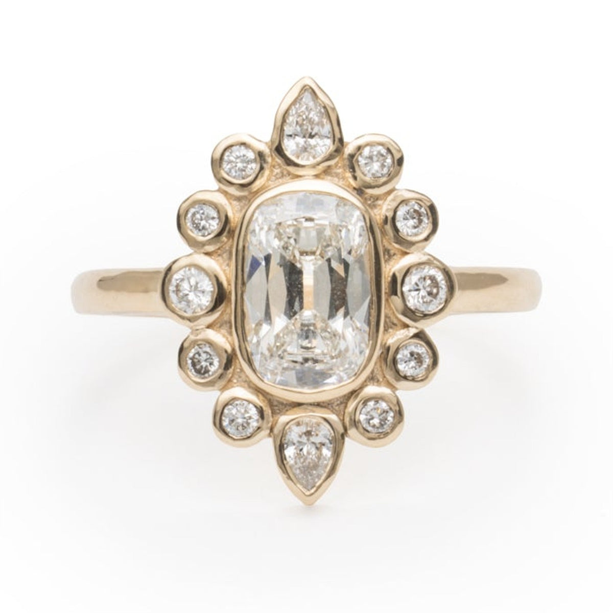Lili cushion lab diamond ring in 14k gold with a halo of bezel-set round and pear lab diamonds, front view