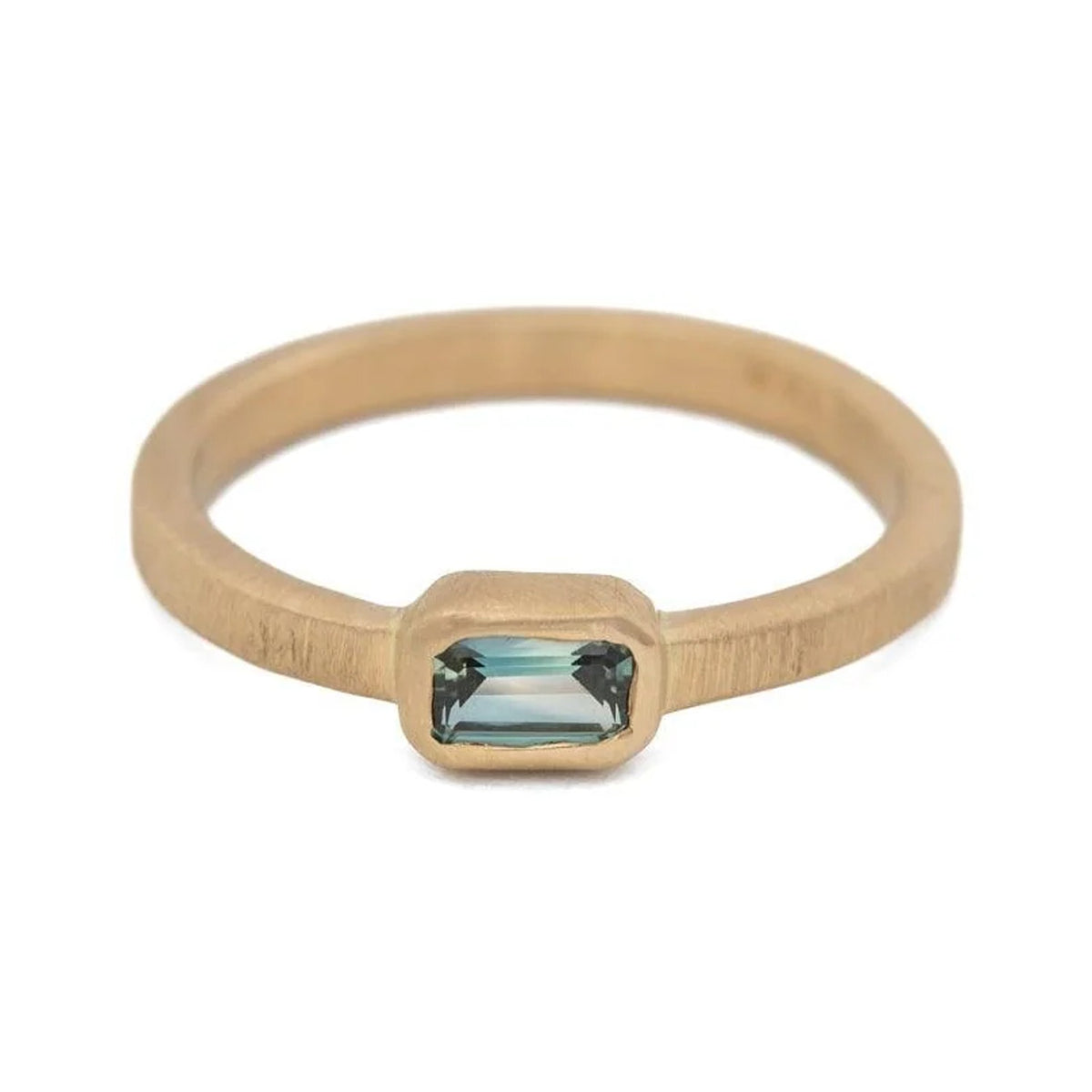 Lucy baguette sapphire ring in matte 14k gold with bezel setting, front view