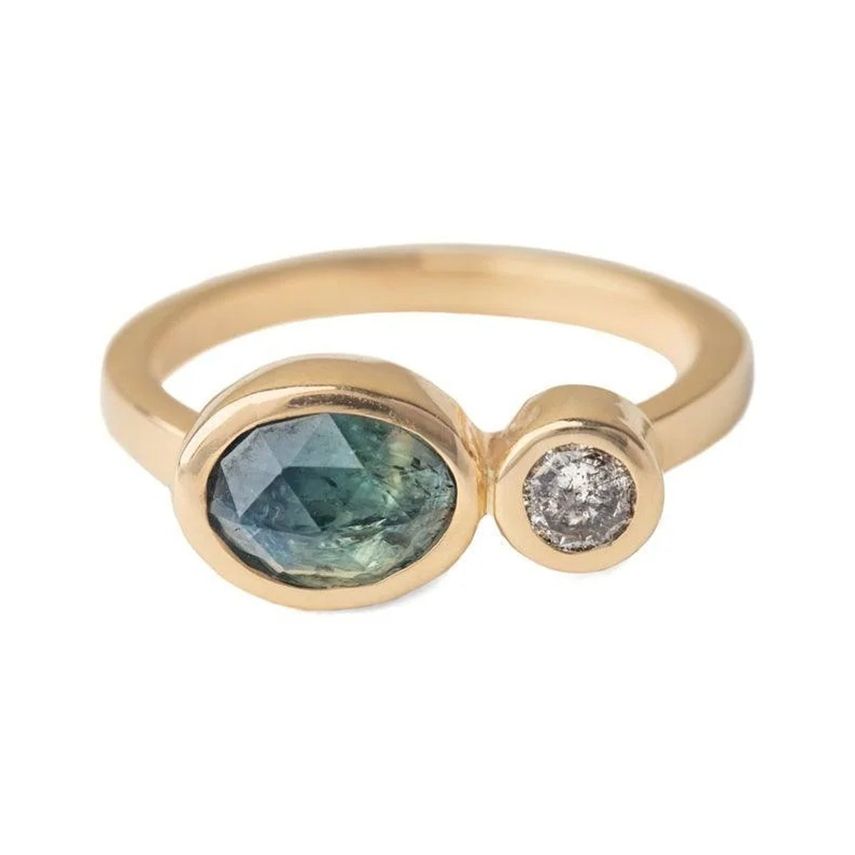 Maria ring in 14k gold with an oval teal sapphire and a salt and pepper diamond, bezel set
