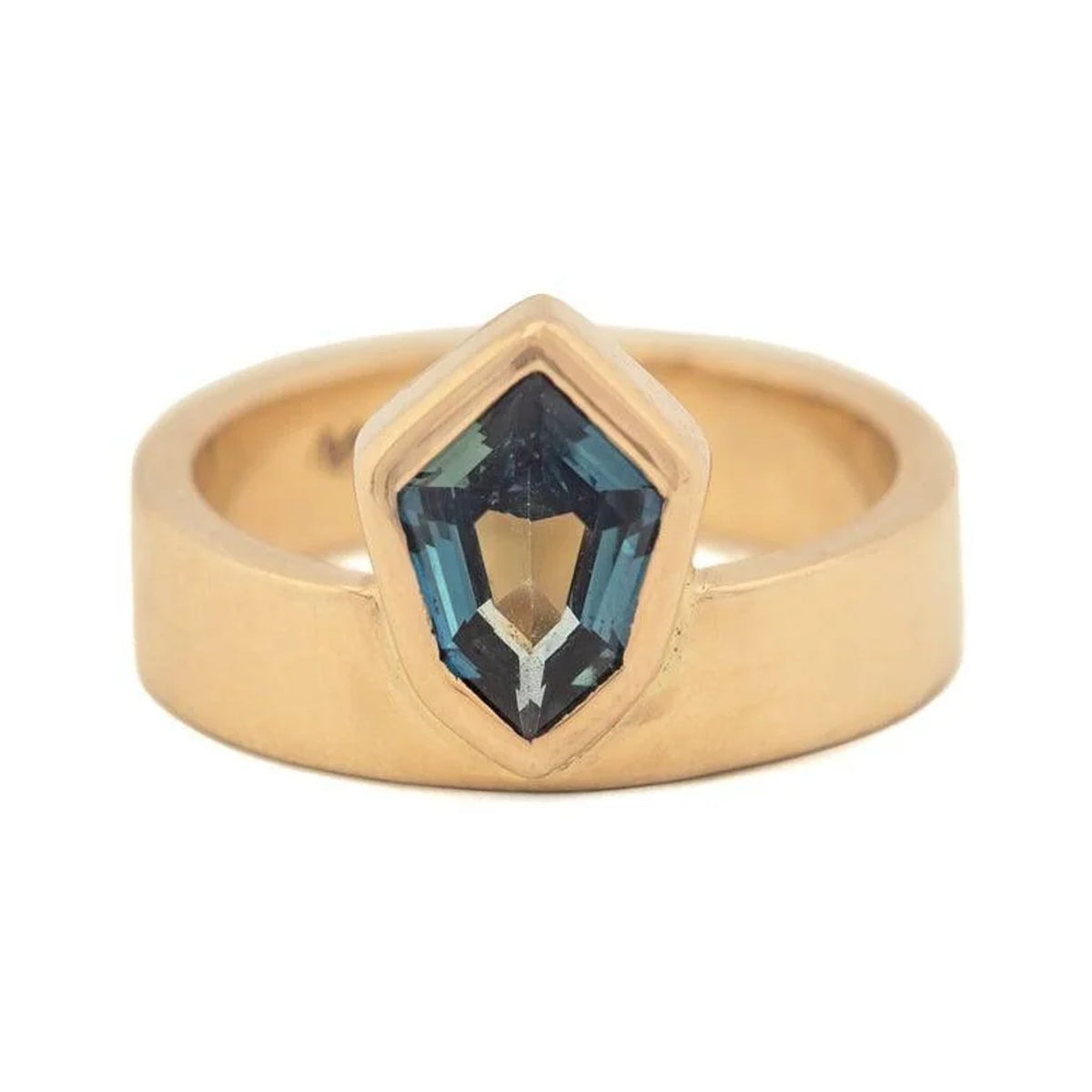 Sofia ring in 14k gold with a bezel-set tapered hexagon teal sapphire on a wide band, front view