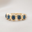 Gold ring with five blue sapphire gemstones