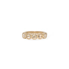 Gold ring with embedded stones on a white background