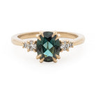 Kat Cadegan custom ring with sapphire and diamonds in 14k with prong setting.