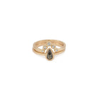 Peri pear salt and pepper diamond ring stacked with a gold crown band, front view