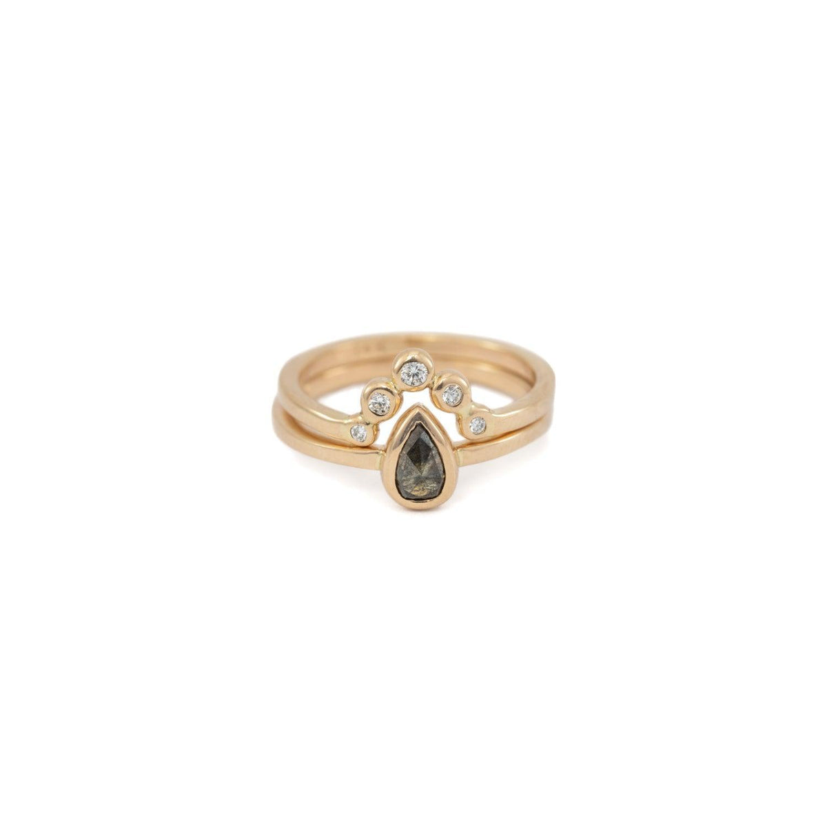 Peri pear salt and pepper diamond ring stacked with a gold crown band, front view