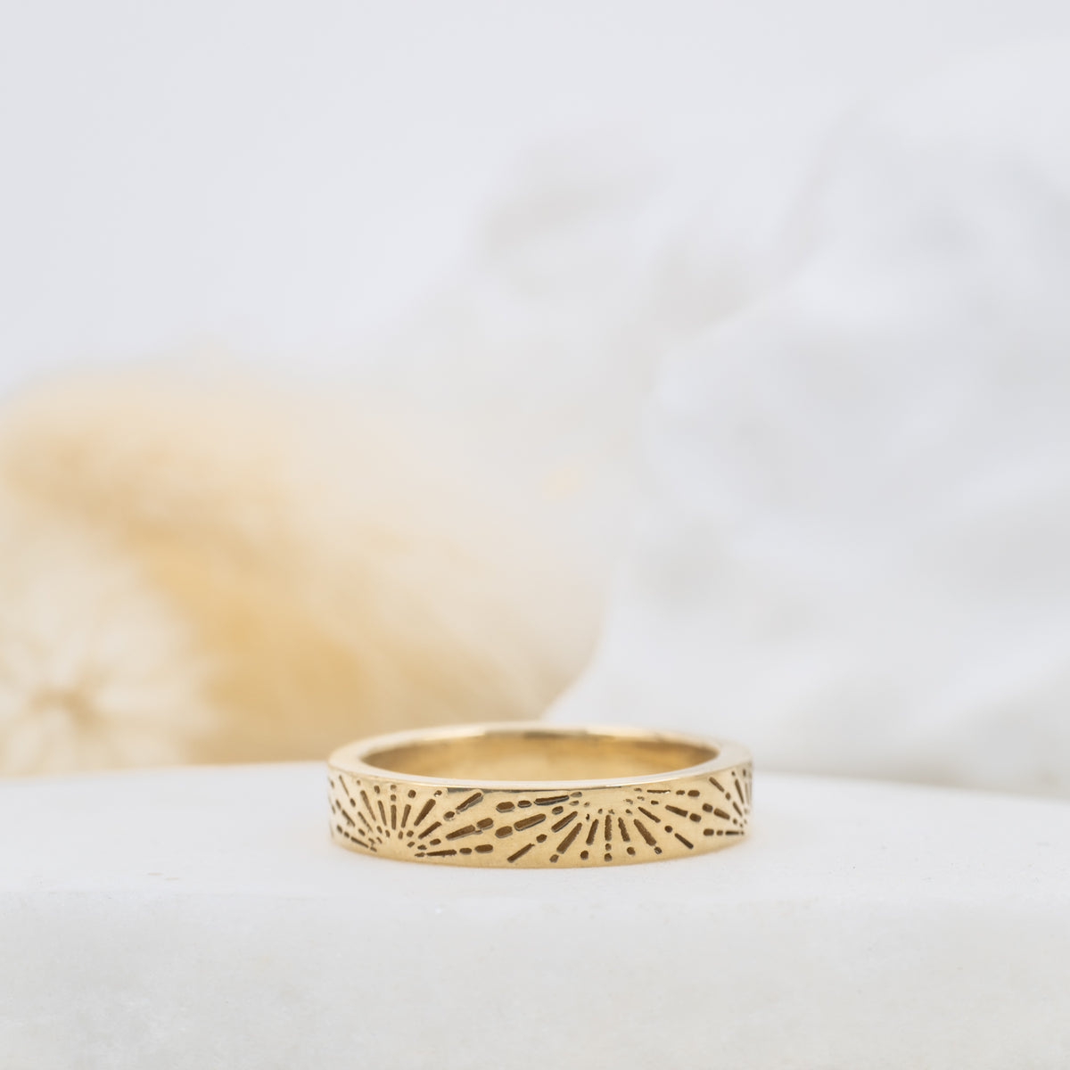Soleil sunburst engraved gold wedding band, styled - Kat Cadegan
