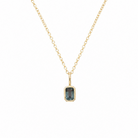 14 karat yellow gold pendant featuring a light blue spinel gemstone in a minimalist bezel setting on a fine gold chain. 